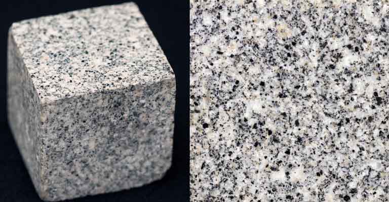 Double colour image of square gray rock block speckled with black, white and gray