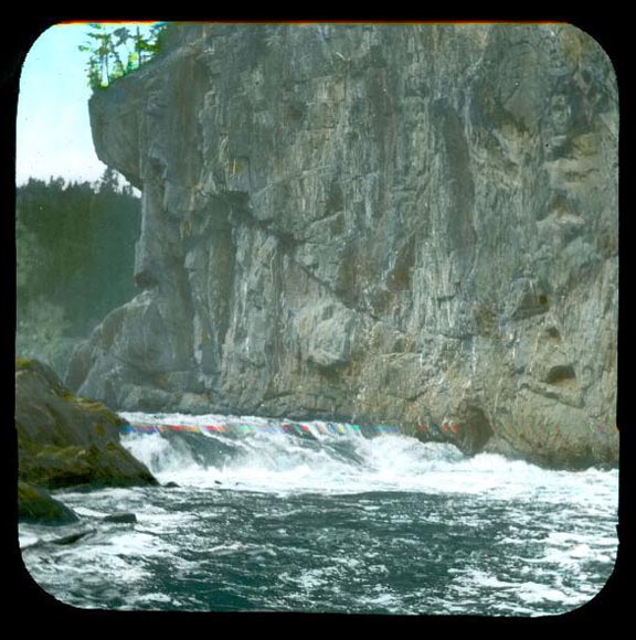 Colour image of water and rock cliff