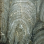 Colour image of gray rock with light gray circles